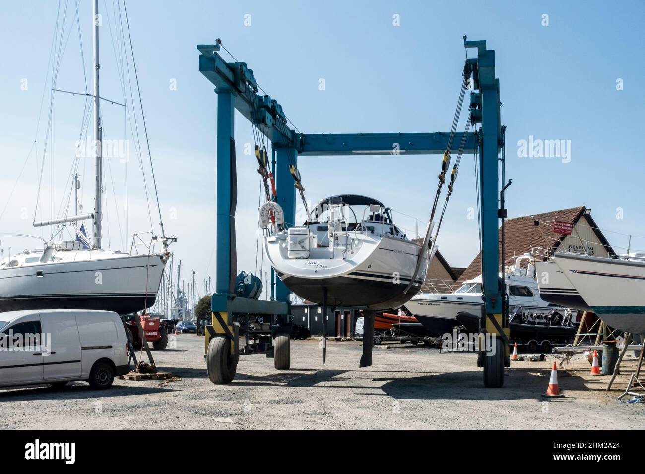 A yacht being transported through Largs Marina, North Ayrshire, Scotland, on a boat hoist Stock