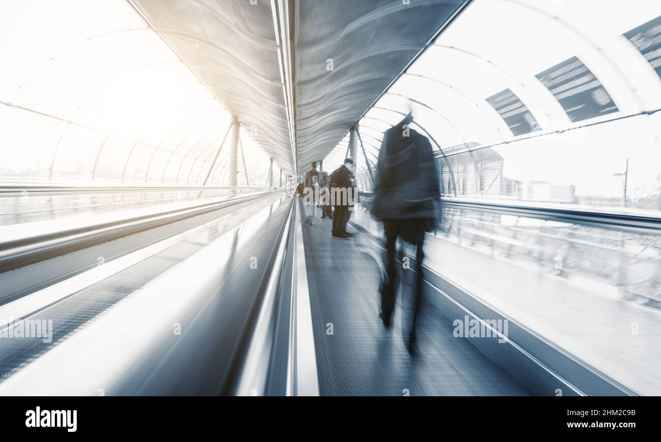 abstrakt Commuters in speed on a escalator Stock Photo