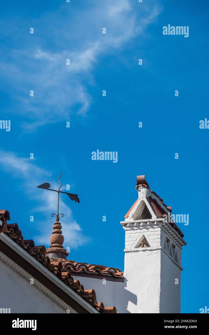 Weathervane and chimney in Spanish Colonial Revival style typical of