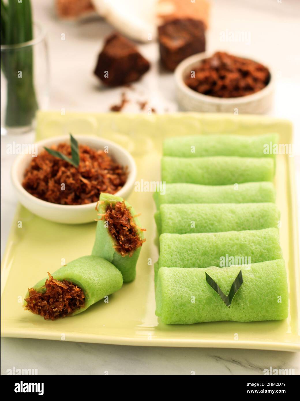 Dadar Gulung, Traditional Snack Made from Glutinous Rice, Grated Coconut, and Palm Sugar. Popular in Malaysia, Indonesia, and Singapore. Served in Gre Stock Photo