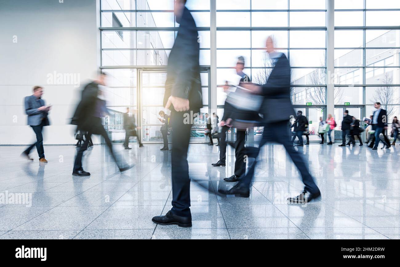 abstakt image of blurred Business people walking Stock Photo - Alamy