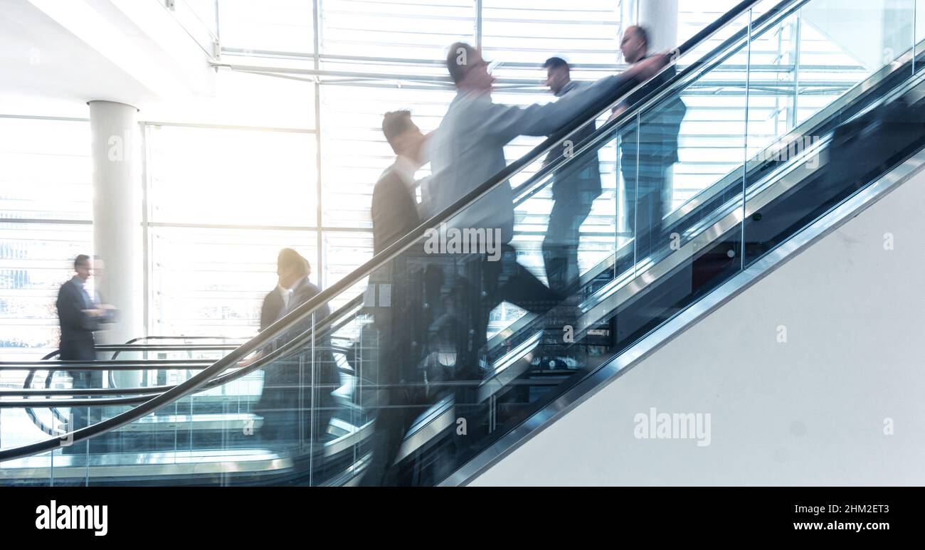 business people on a escalator - business concept Stock Photo