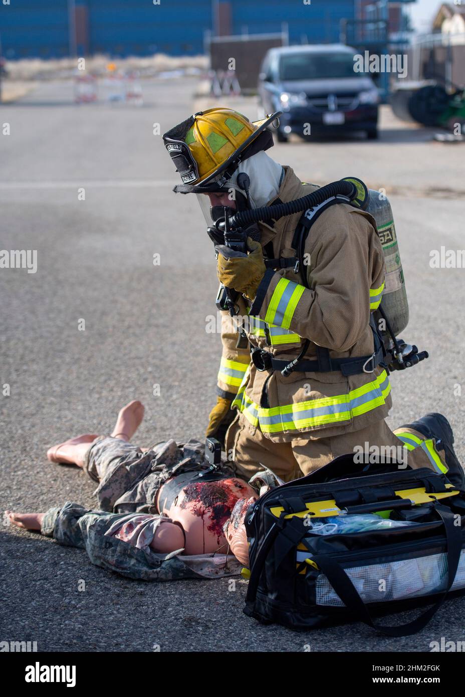 Members of the 124th Logistics Readiness Squadron, Gowen Fire Department, respond to a simulated fire with simulated casualties while participating in a wing focus exercise at Gowen Field in Boise, ID, Feb. 4-6, 2022. The WFE consisted of multiple scenarios where members were met with different alarms requiring them to test their MOPP gear and respond to attacks. (U.S. Air National Guard photo by Capt. Bonnie Blakely) Stock Photo