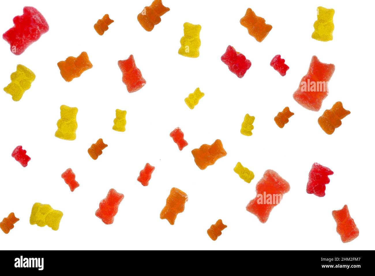 Jelly bears isolated on a white background. Jelly multi-colored bears assorted on a white background.Sweet pattern in yellow and red colors. Sweets Stock Photo