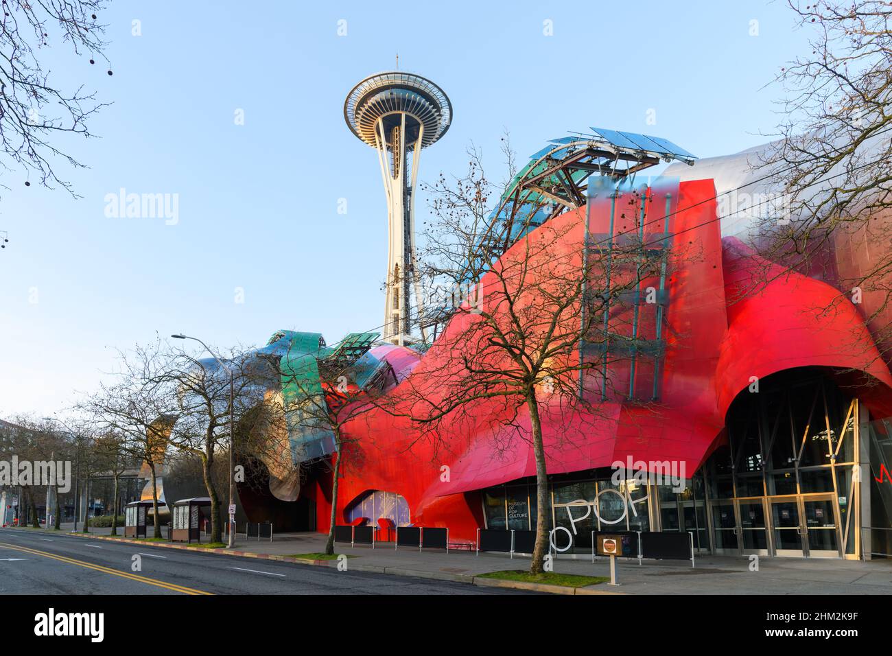 Seattle - February 06, 2022; Modern building housing the Museum of Pop Culture or MoPOP in front of the Seattle Space Needle in morning light Stock Photo