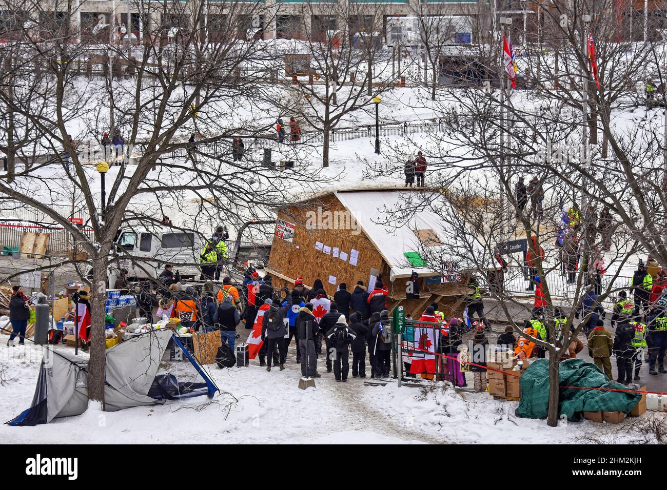 Ottawa, Canada – February 6, 2022: Protesters move a shack they put up to provide support to their convoy members after they agreed with the police to move it to the new designated site outside the downtown area.  The protest has shutdown much of downtown Ottawa and caused a lot of grief for local residents and business. Stock Photo
