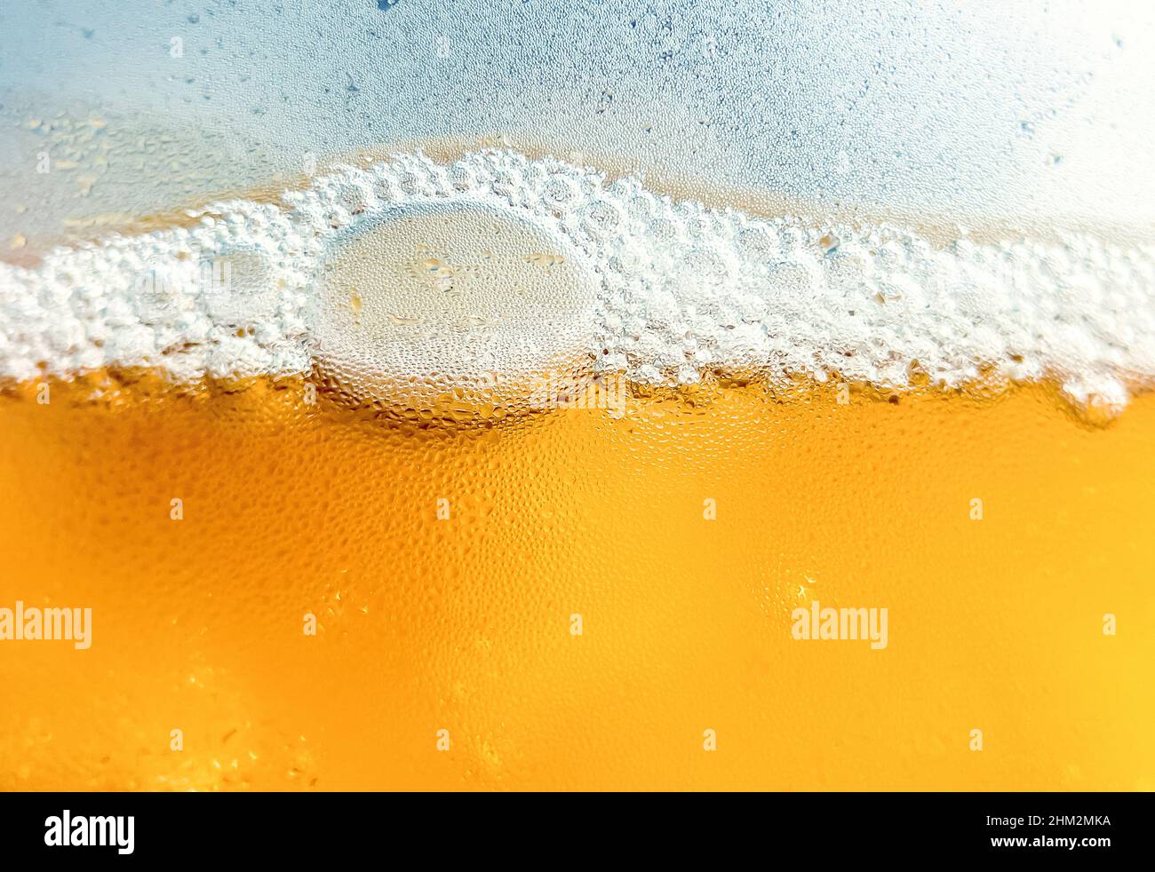 Glass with cold drink beer with condensation ice cool beverage background Stock Photo