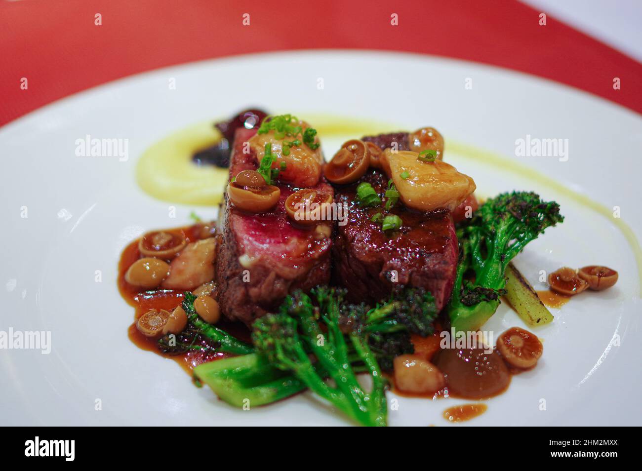 Red wine braised beef grilled steak with small mushroom and broccoli