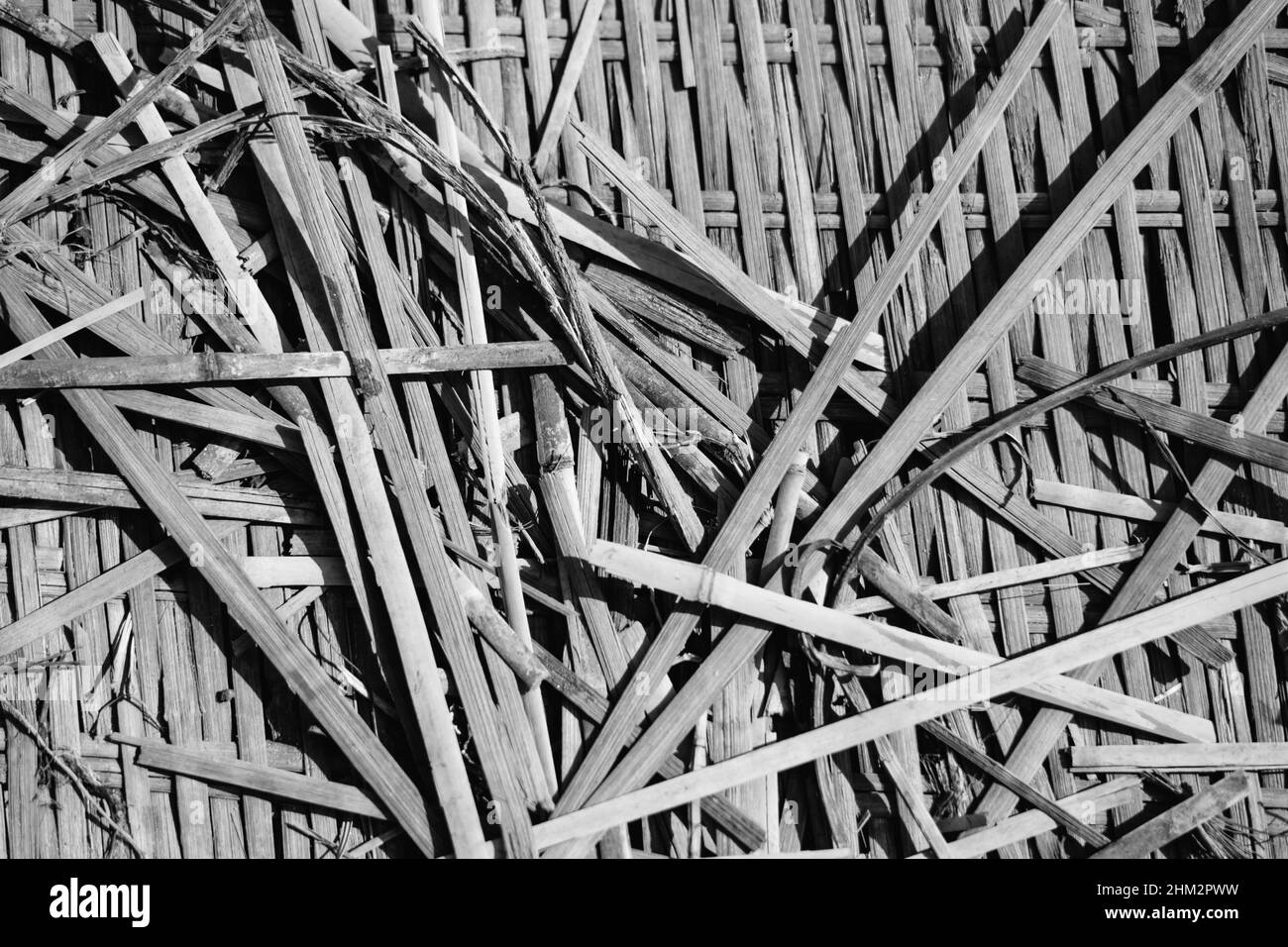 Real nature abstract background. Bamboo straws weaving texture mat, light dark black white gray colour vintage effect. Calm warm simple life style Stock Photo