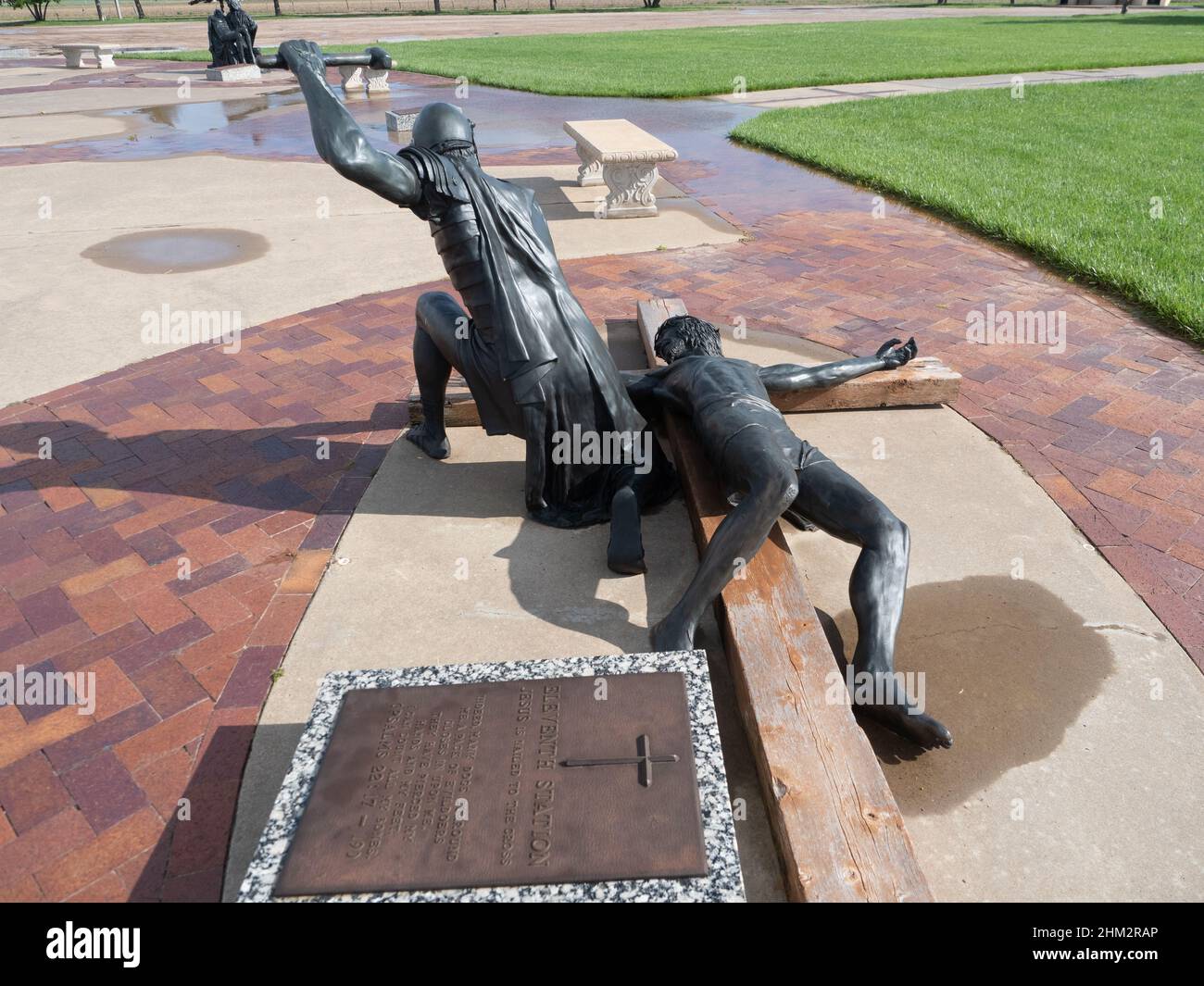 Jesus Christ being nailed to the cross by a Roman soldier. Statue is