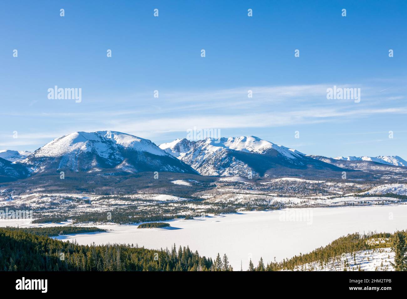 Beautiful winter landscape with evergreen trees and ski tracks in the Rocky Mountains, Colorado, near lake Dillon Stock Photo