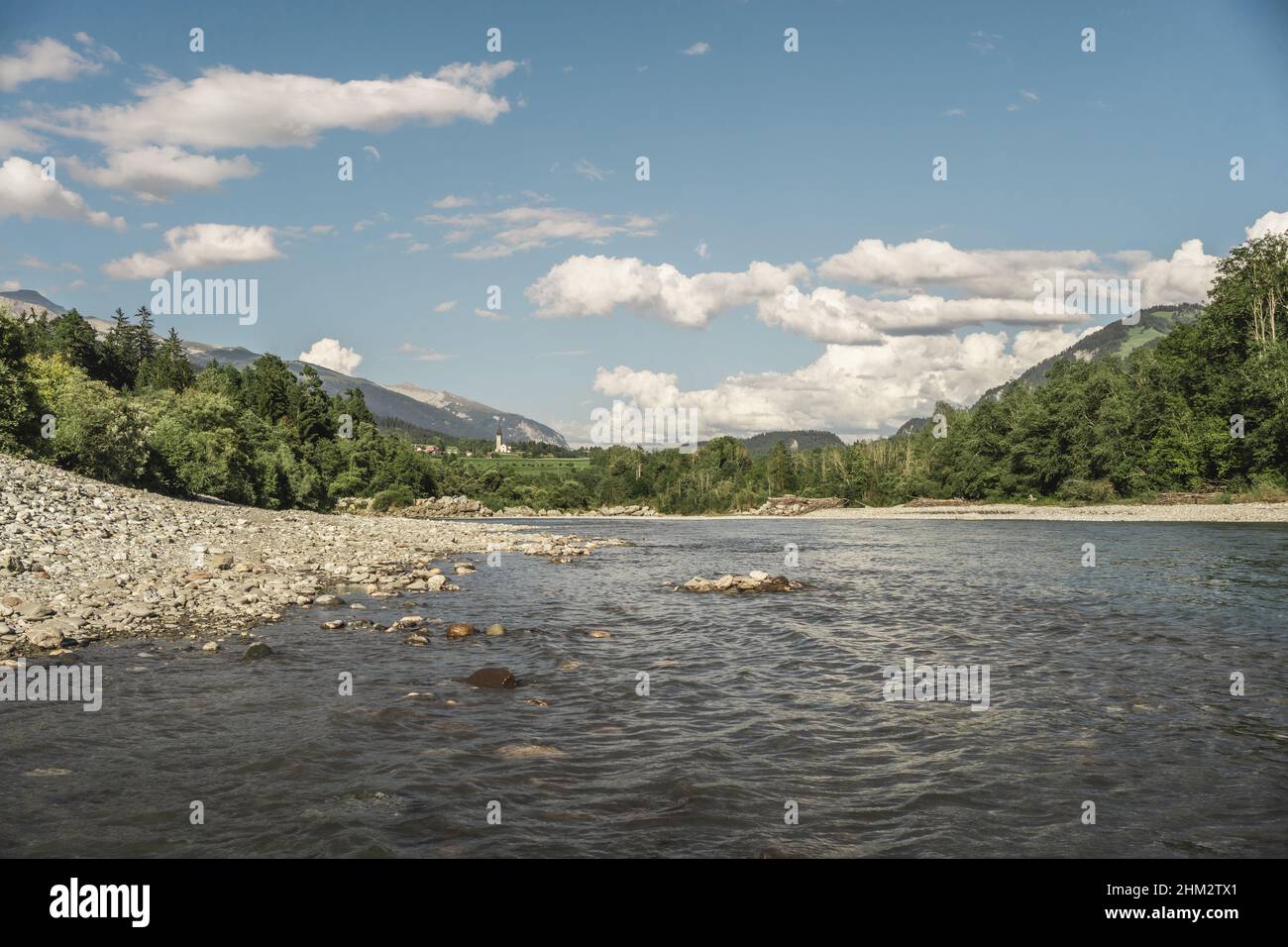 Beautiful view of a lake in a forest under the blue sky Stock Photo - Alamy