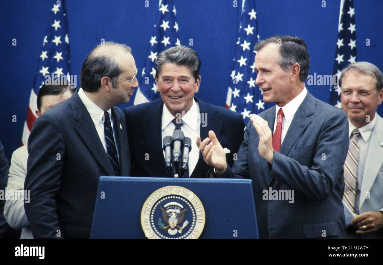 Austin Texas USA, 1984: Pres. Ronald Reagan (center) and Vice Pres. George H.W. Bush (in red tie) are joined by other prominent Republicans during presidential re-election campaign rally. ©Bob Daemmrich Stock Photo