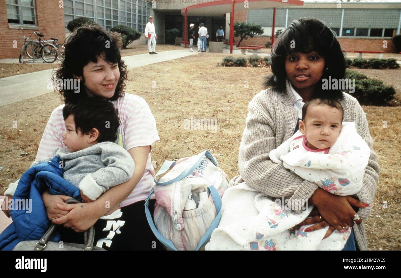 Austin, Texas USA 1989: Teen mothers who attend classes at Travis High School while their children stay at school-sponsored day-care center. No MR. ©Bob Daemmrich Stock Photo