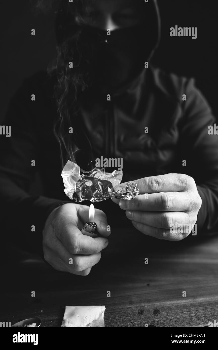 Addict/junkie man preparing drugs. The concept of crime and drug addiction Stock Photo Alamy