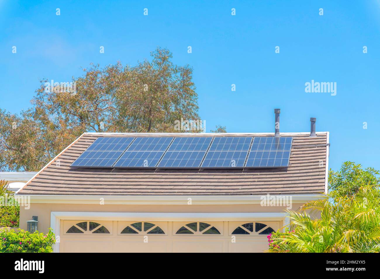 Solar panels on top of the garage roof with vents in Laguna Niguel in