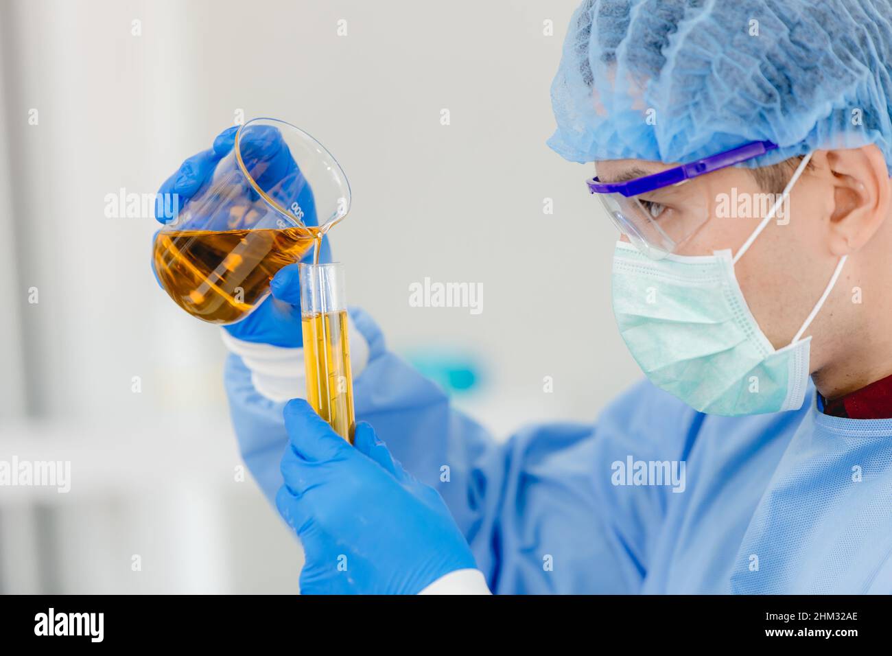 Scientist testing petrochemical fuel formula in science lab. synthetic oil lube test and analysis in laboratory. Stock Photo