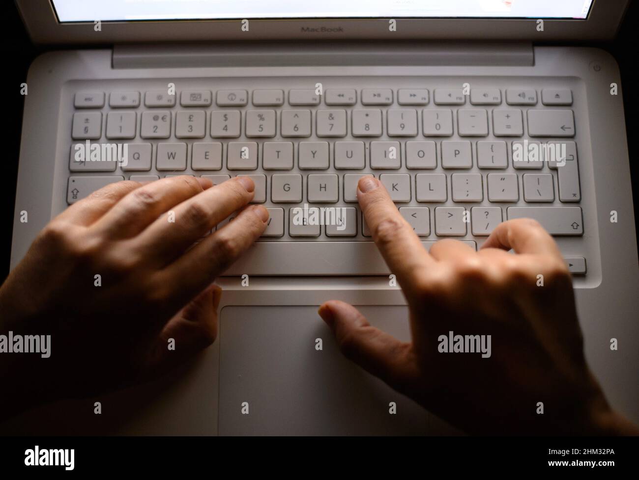 File photo dated 06/08/2013 of someone using a laptop keyboard. University researchers say a new project examining the impact of moving key public services online on minority ethnic communities will play 'an important role in tackling racial inequality'. Issue date: Monday February 7, 2022. Stock Photo