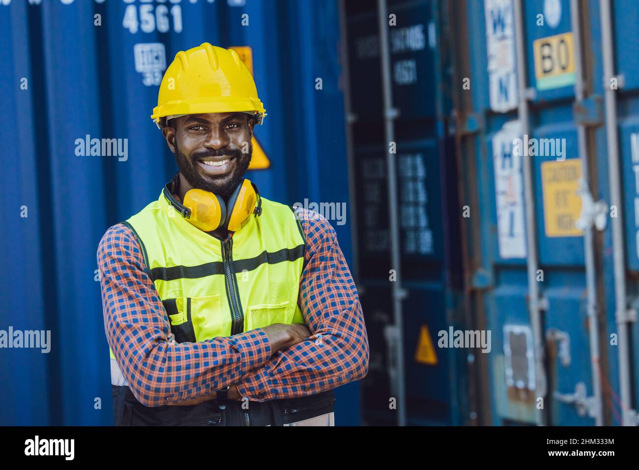 happy black worker confident smiling work in logistic cargo import export industry Stock Photo