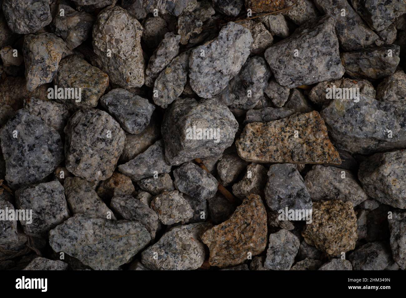 Dark rough edges stone gravel texture for wallpaper and background. Abstract background. Texture background. Macro photography. Close up. Stock Photo