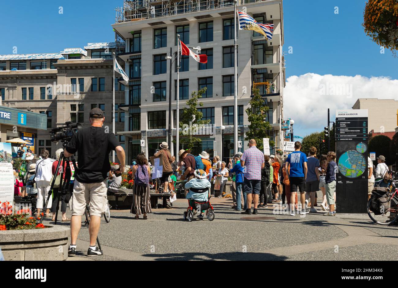 Rear view of people with placards and posters on global strike for climate change-July 21,2021-Victoria BC, Canada. Street photo, event, selective foc Stock Photo