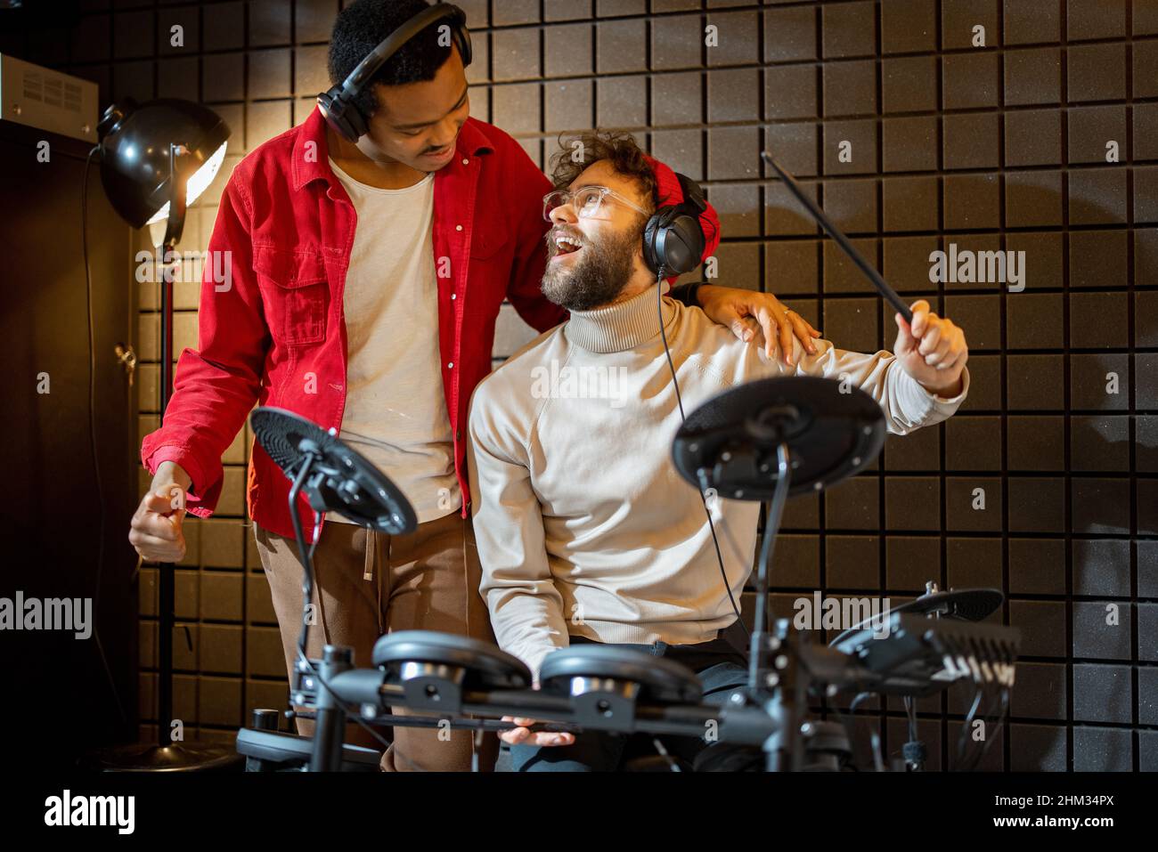 Men playing electric drums at home sstudio Stock Photo