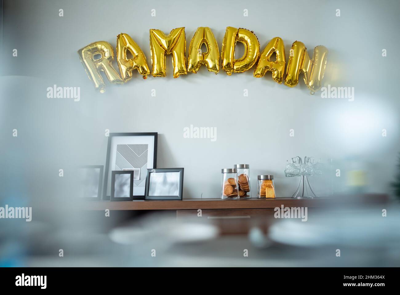 Ramadan gold balloon text on the wall Stock Photo
