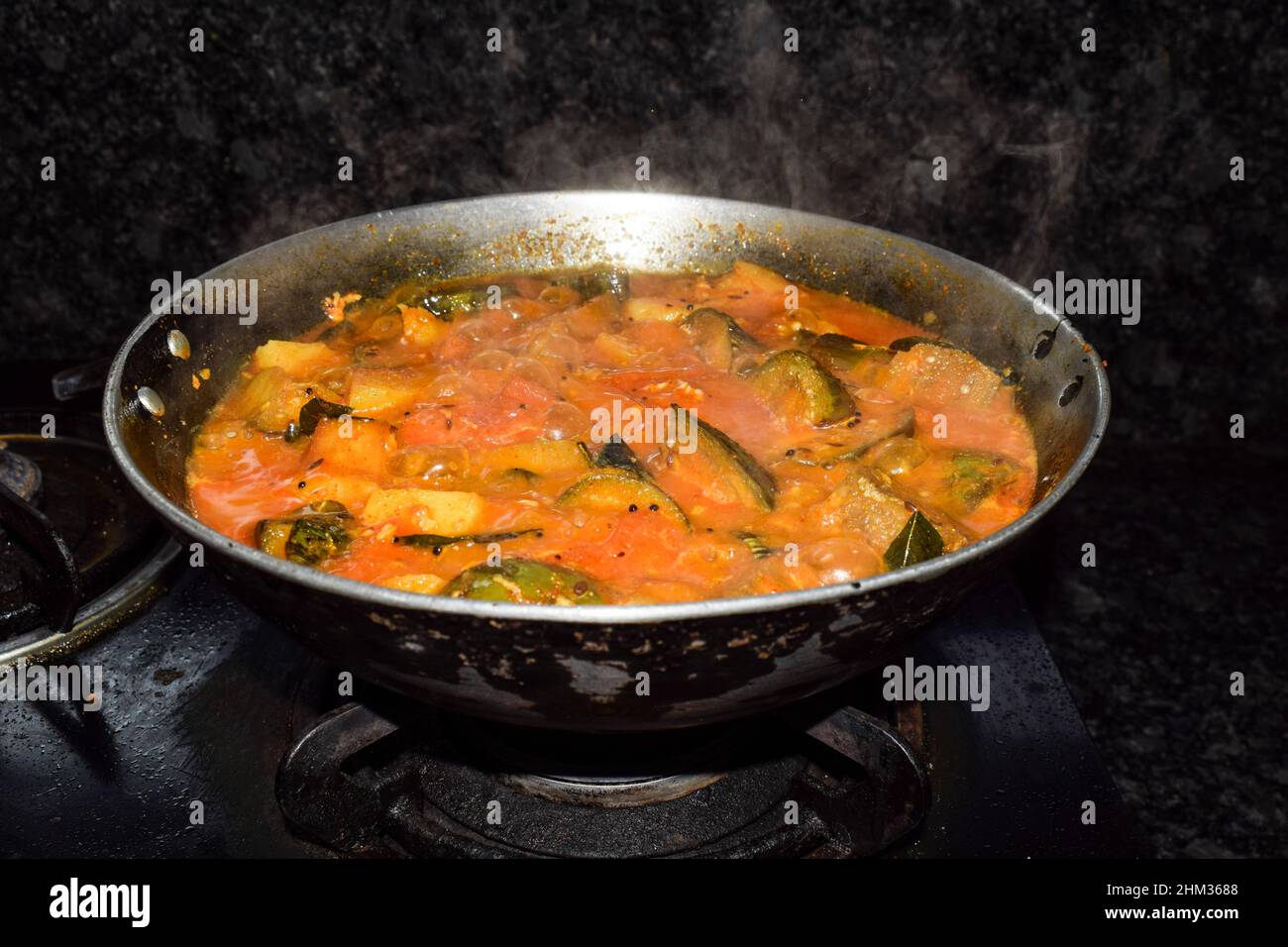 Mix potato and brinjal gravy Indian style curry cooked on gas 
