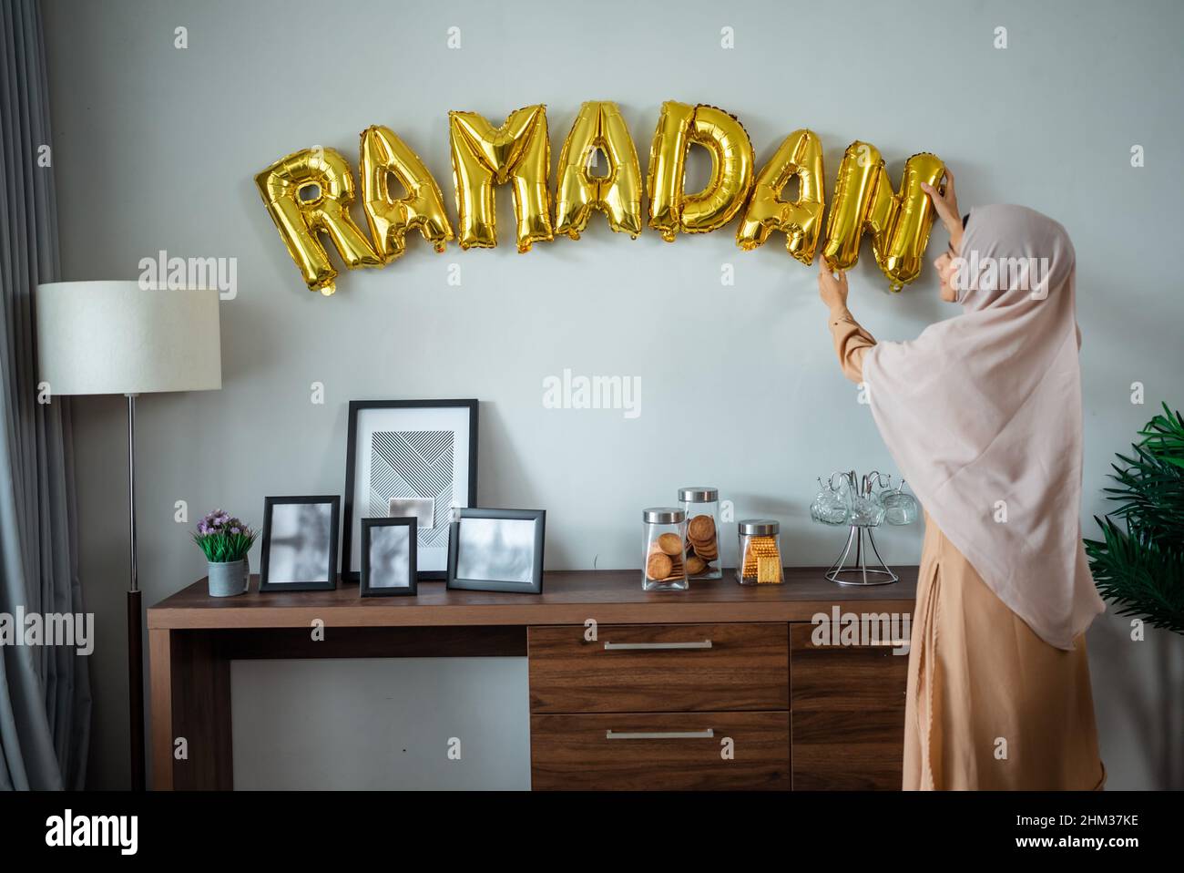 Ramadan gold balloon text on the wall Stock Photo