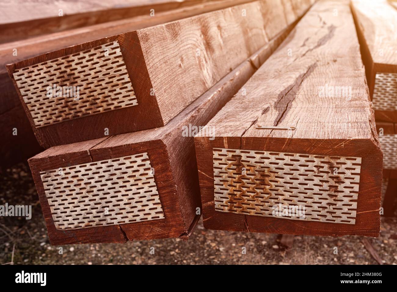 Stacked railway sleepers closeup, treated oak wood timber Stock Photo