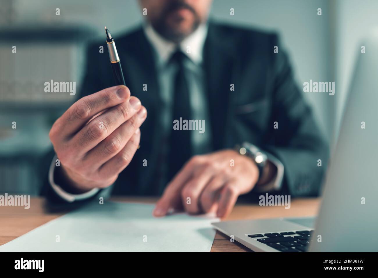 Sign here, bank loan officer offering pen for client to put signature on agreement, selective focus Stock Photo
