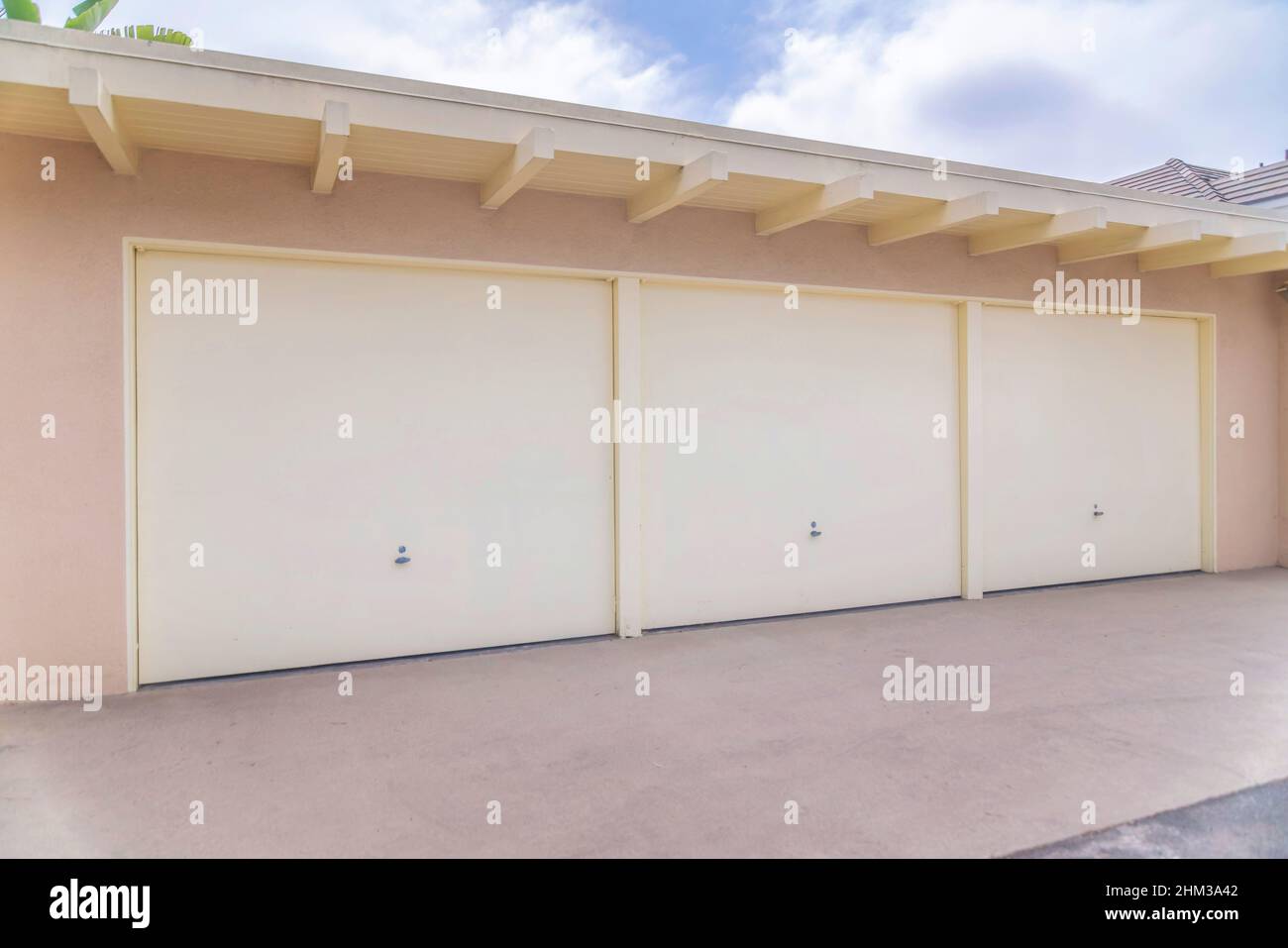 Beige tiltup garage doors at Carlsbad, San Diego, California Stock