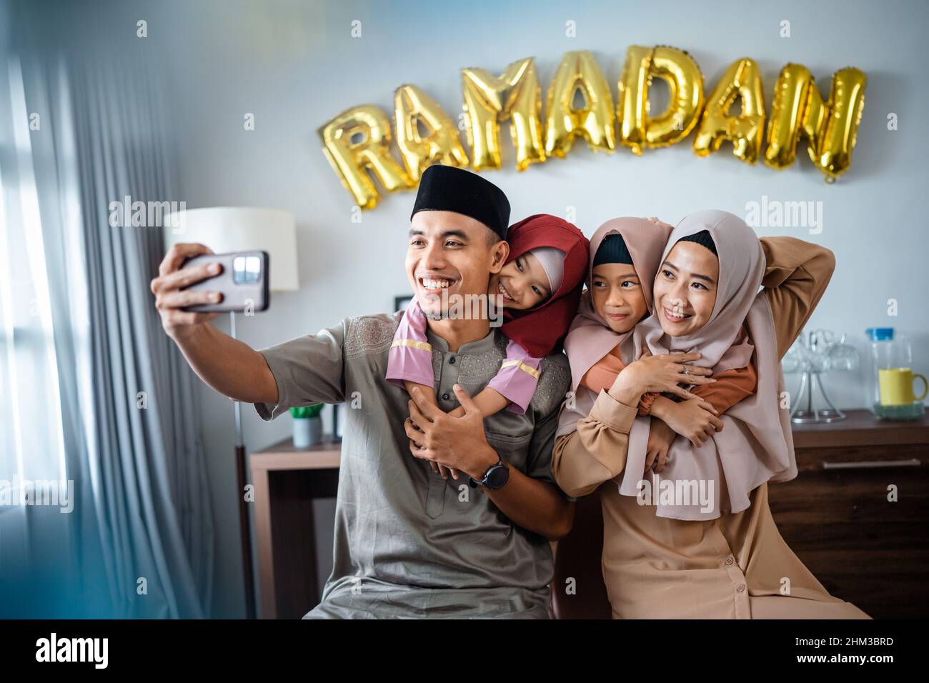 happy muslim family take selfie together in ramadan Stock Photo