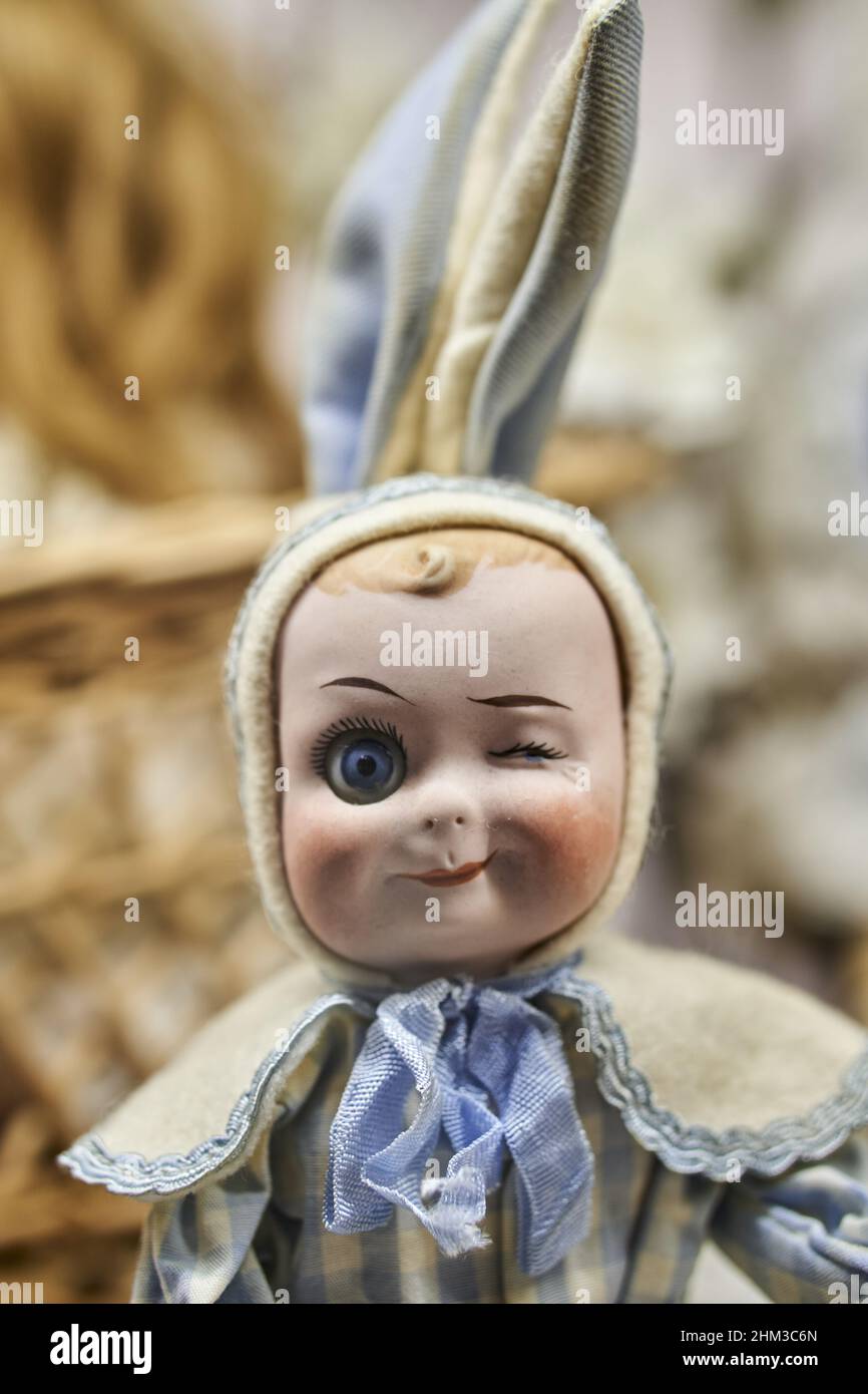 Vertical shot of a doll dressed as a rabbit in the toy museum during ...
