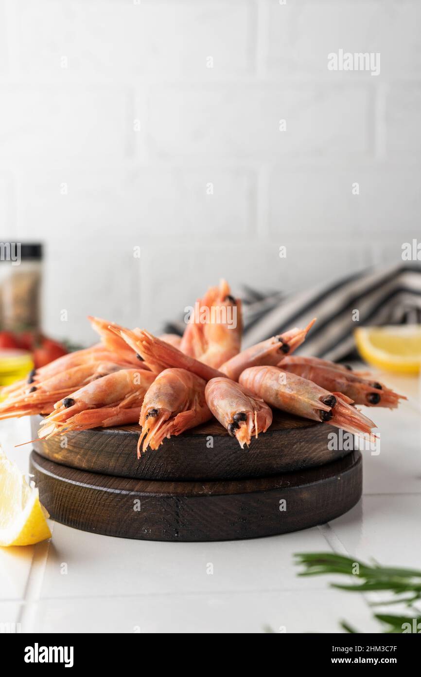 Thawed peeled shrimp, seafood, delicacy. on a white background, in a ...