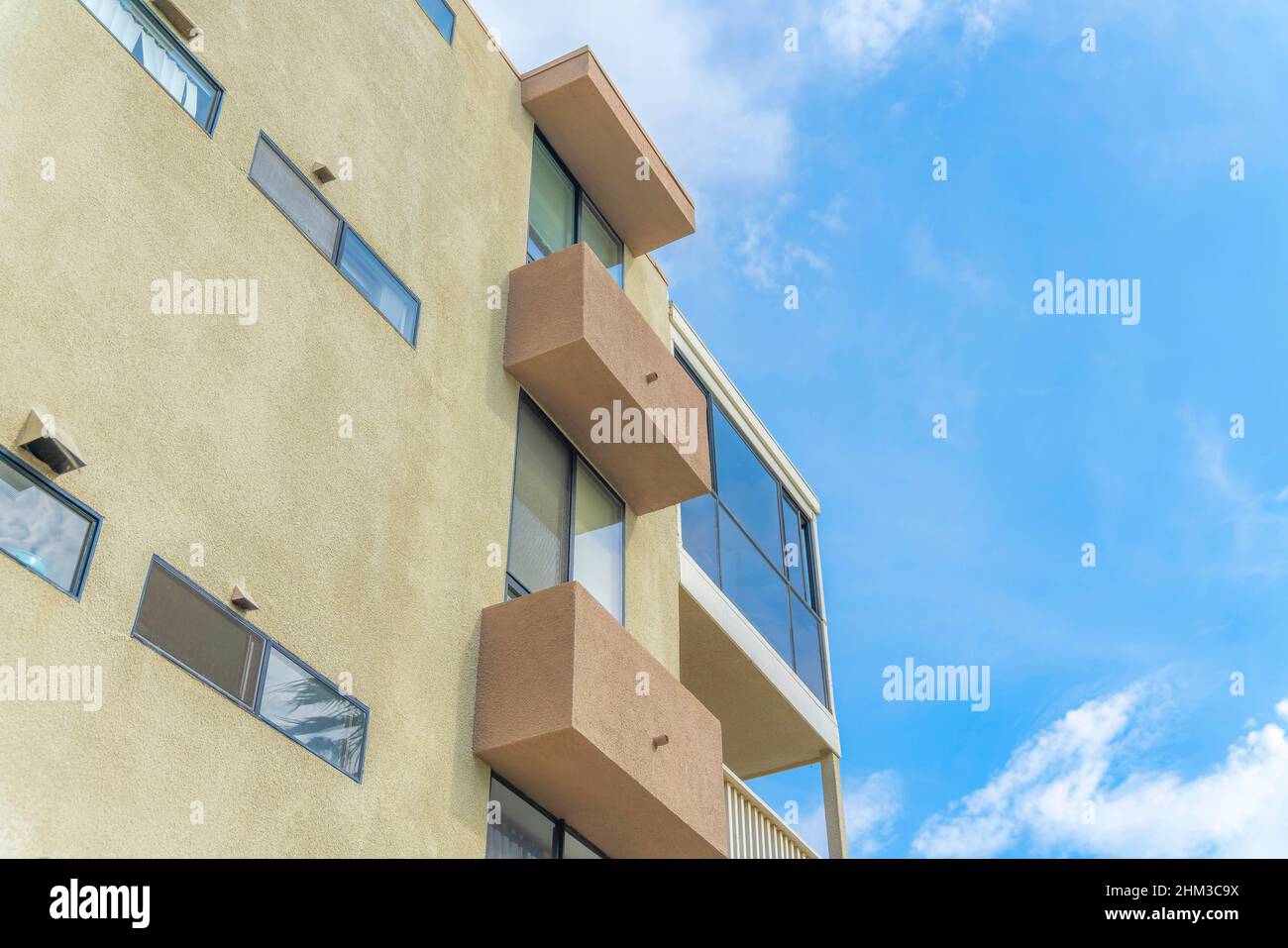 Exterior of a building with concrete window awnings at Carlsbad, San