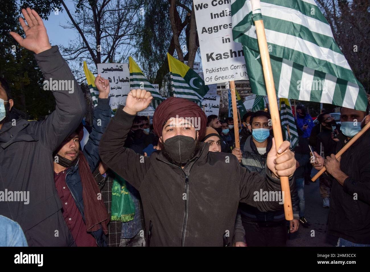 Pakistanis living in Greece rally in front of the Greek Parliament shouting slogans and waving flags of Kasmir to mark Kashmir Solidarity Day. Stock Photo