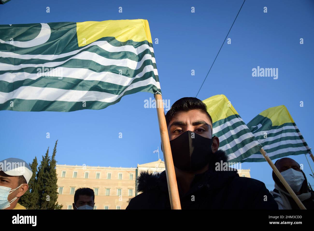 Pakistanis living in Greece rally in front of the Greek Parliament shouting slogans and waving flags of Kasmir to mark Kashmir Solidarity Day. Stock Photo