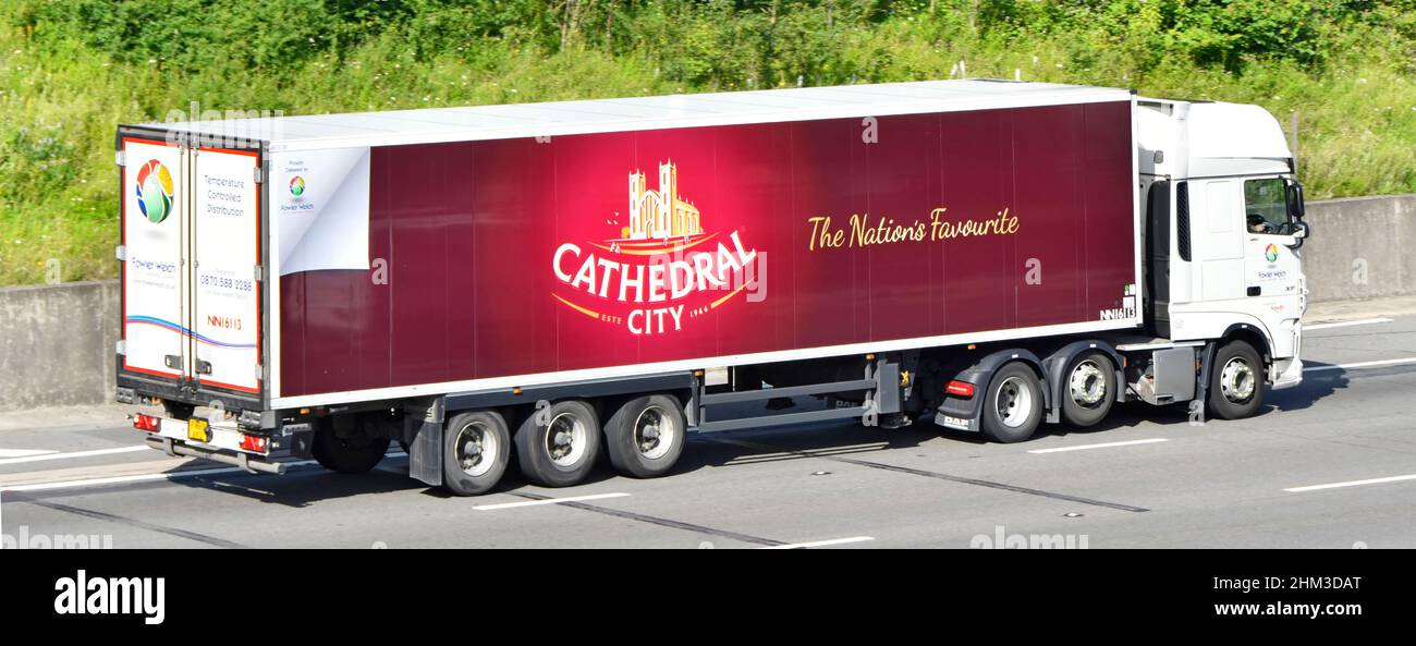 Food business advertising Cathedral City a Dairy Crest brand Cheddar cheese side view articulated trailer & hgv lorry truck motorway road England UK Stock Photo
