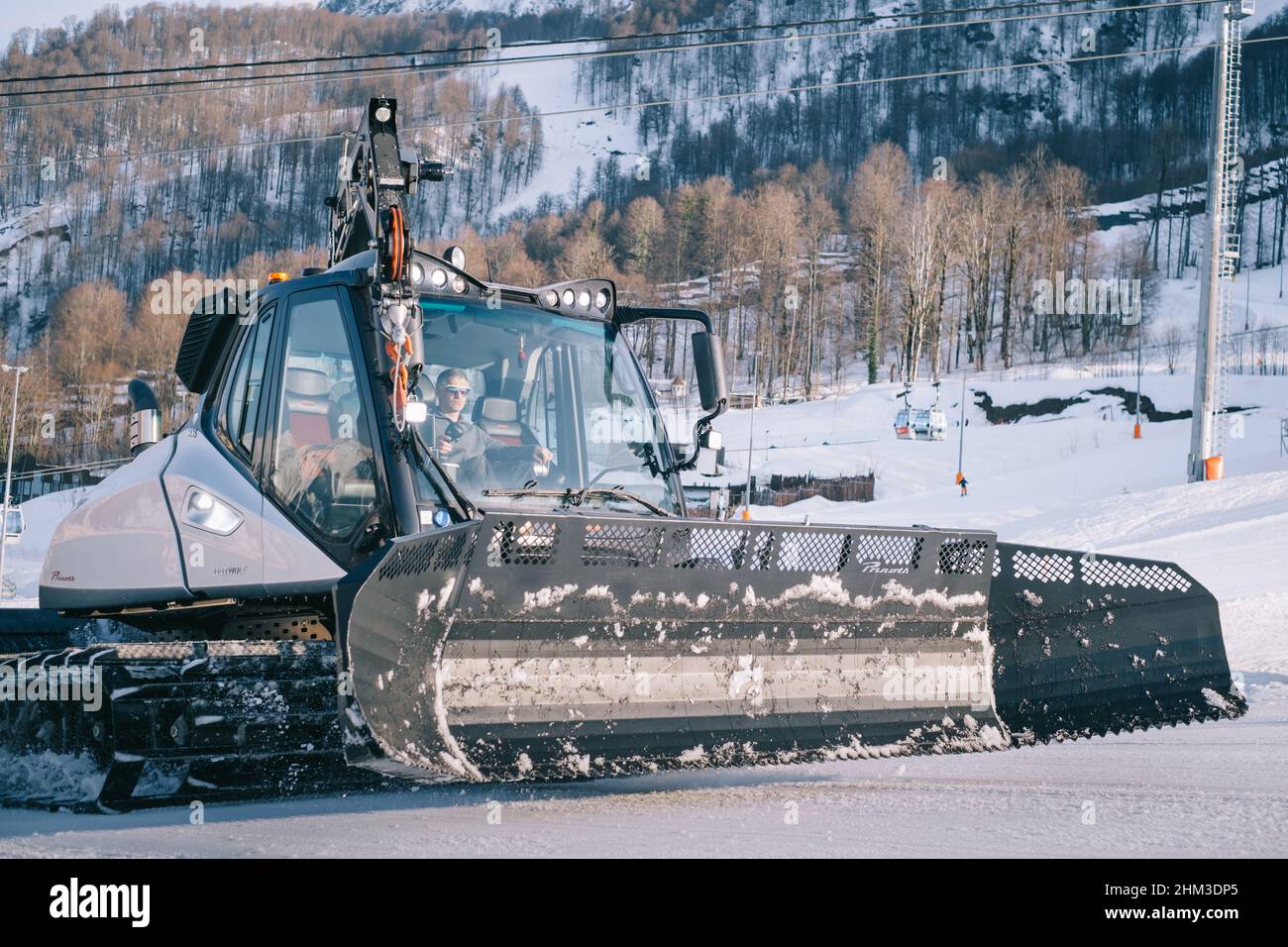 Close up of the Snowcat 'Prinoth' Caterpillar vehicle for maintenance of mountain ski slopes. Stock Photo
