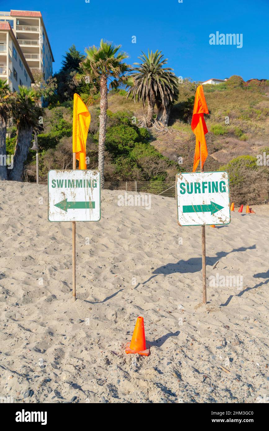 Surfing and swimming signboard at the beach in San Clemente, California ...