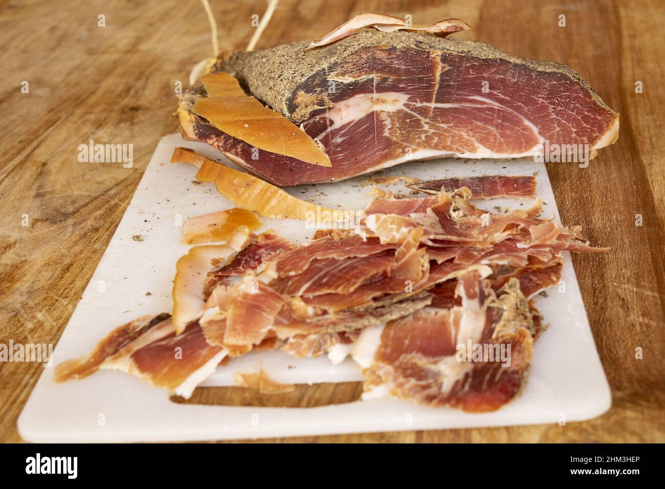 Hand sliced Spanish cured ham Stock Photo Alamy