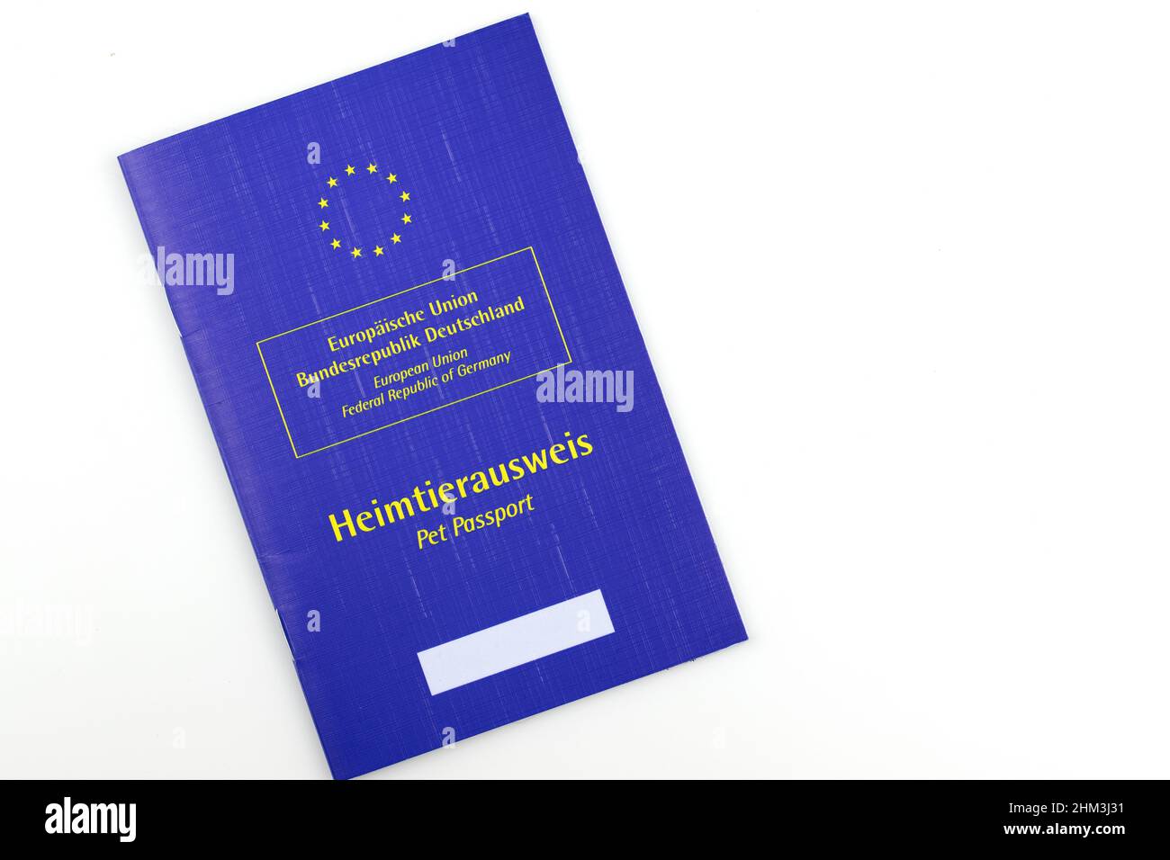 Blue European Union passport for pets with German texts isolated on white background Stock Photo
