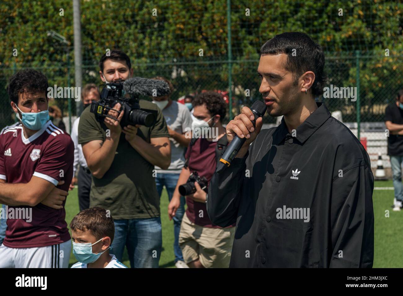 The Italian singer songwriter Mahmood, winner of Sanremo Song Festivals, with the boys of Calcio Sociale in Corviale, on the outskirts of Rome, Italy. Stock Photo