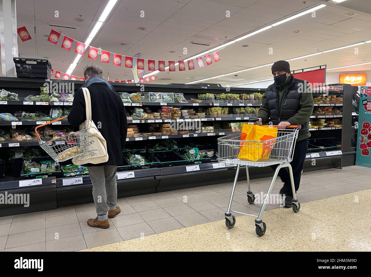London, UK 6 Feb 2022 - Shoppers shopping in a supermarket in north London.  According to John Allan, Tesco chairman, food prices could rise by 5% this  spring, in addition to surges
