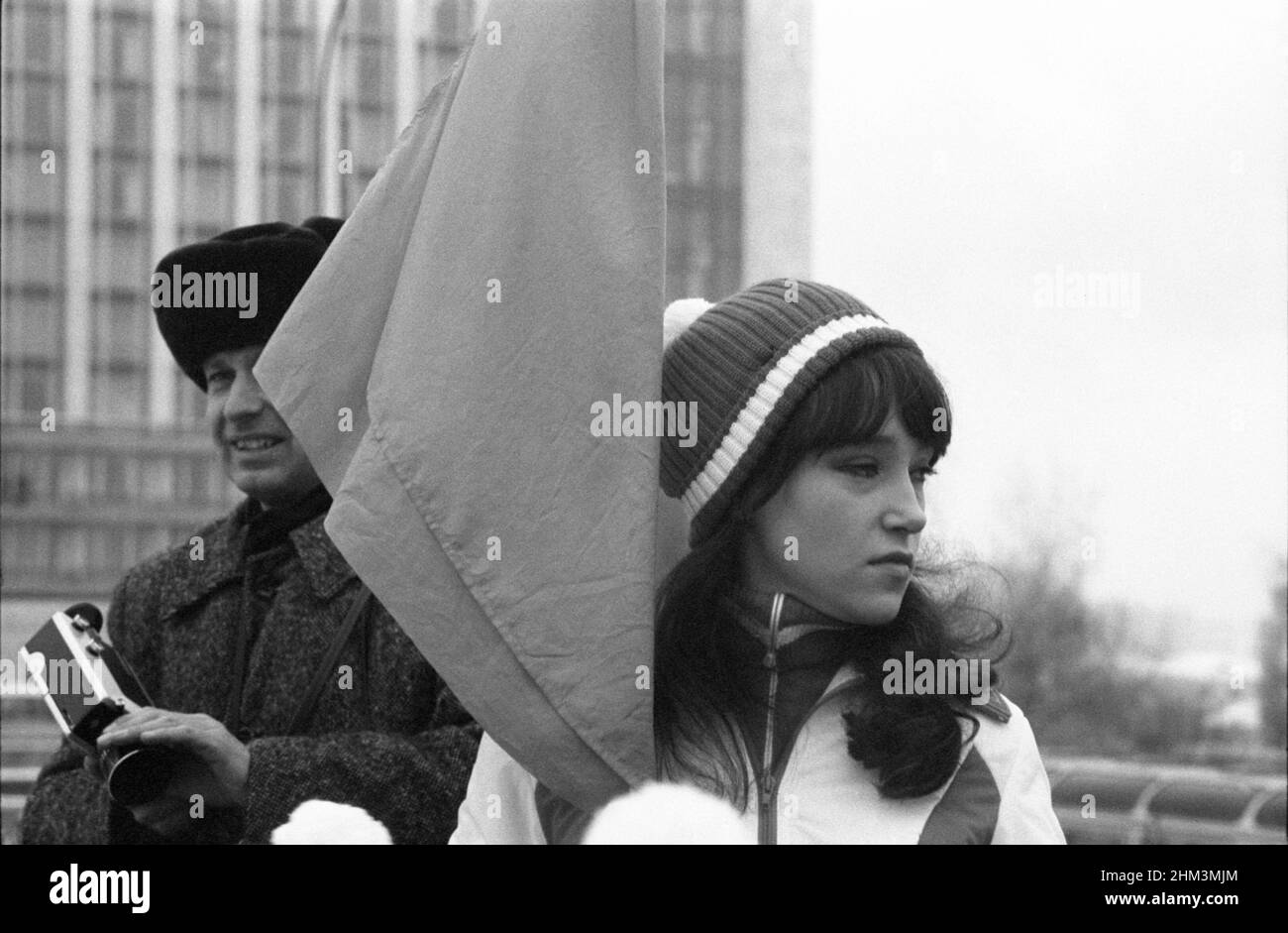 The 60th anniversary of the October Revolution. People come out of Red Square after the parade. Moscow, Russia, USSR, November 7, 1977 Stock Photo