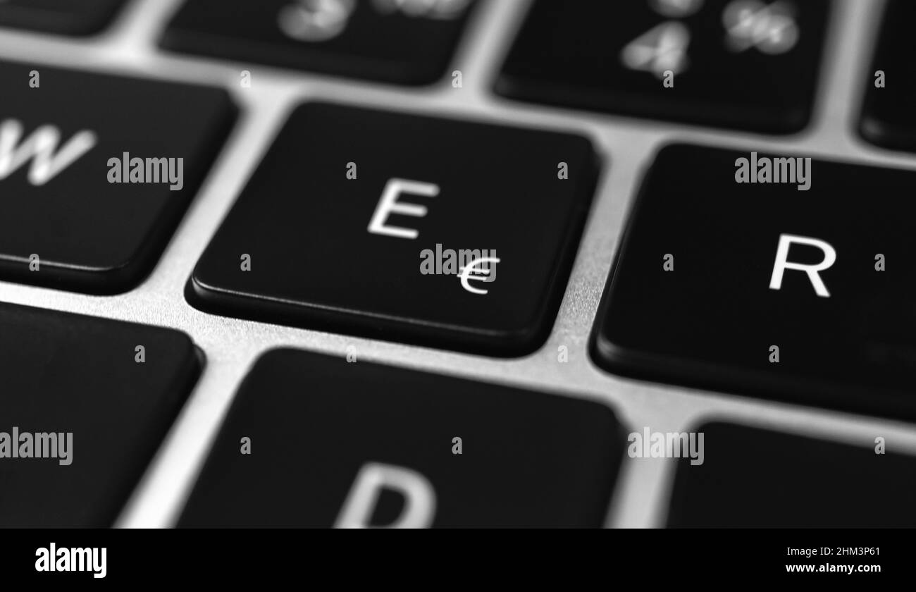 Euro key and button on keyboard. Euro sign closeup. Modern laptop