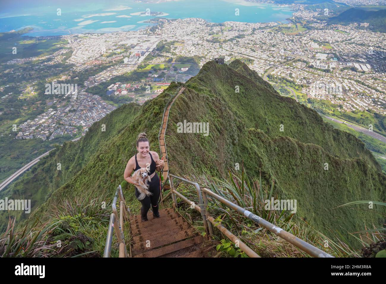 A trespasser poses on Oahu's Stairway To Heaven Stock Photo