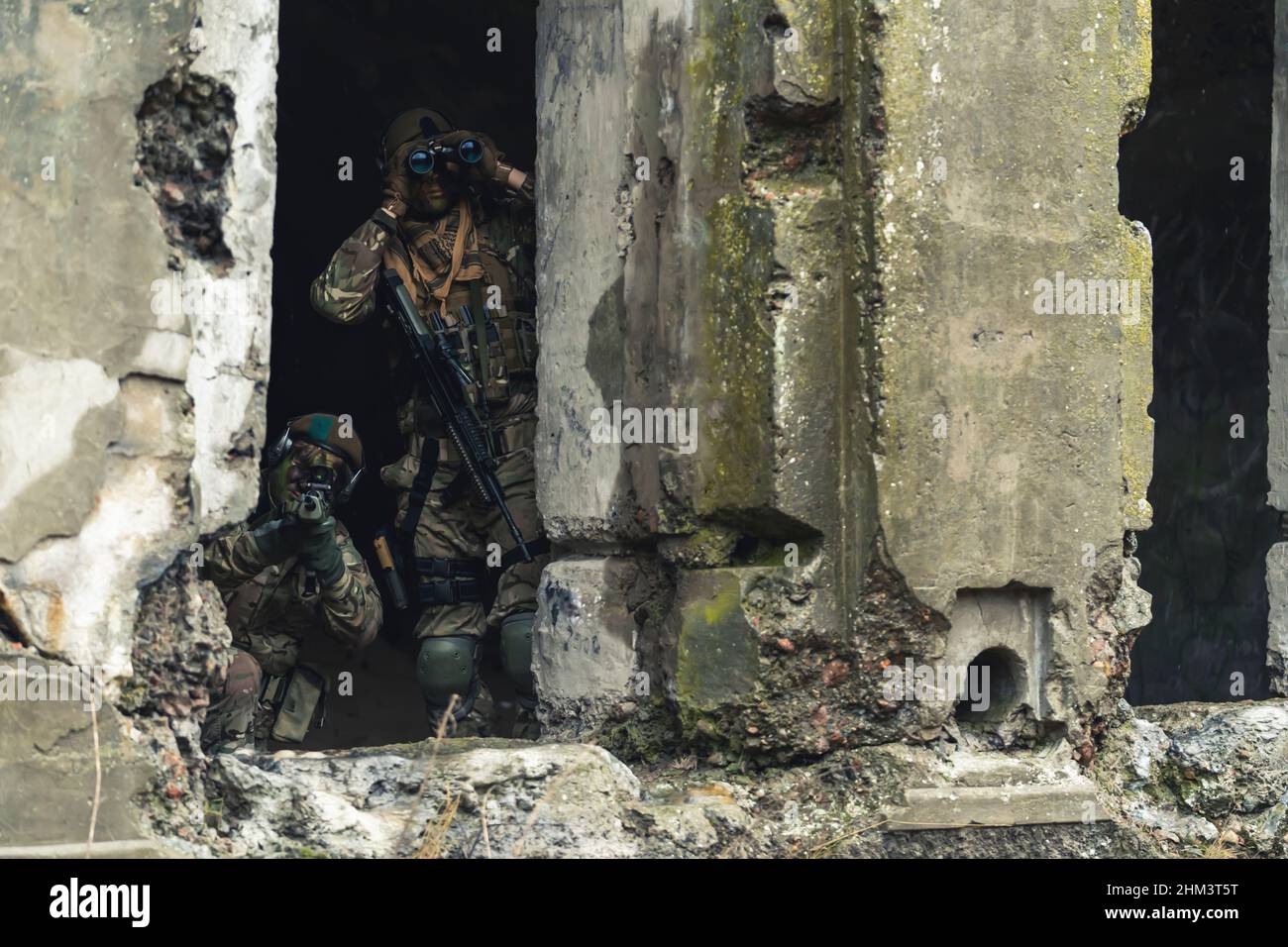 Scanning destructed building for rebel group threats. High quality photo Stock Photo