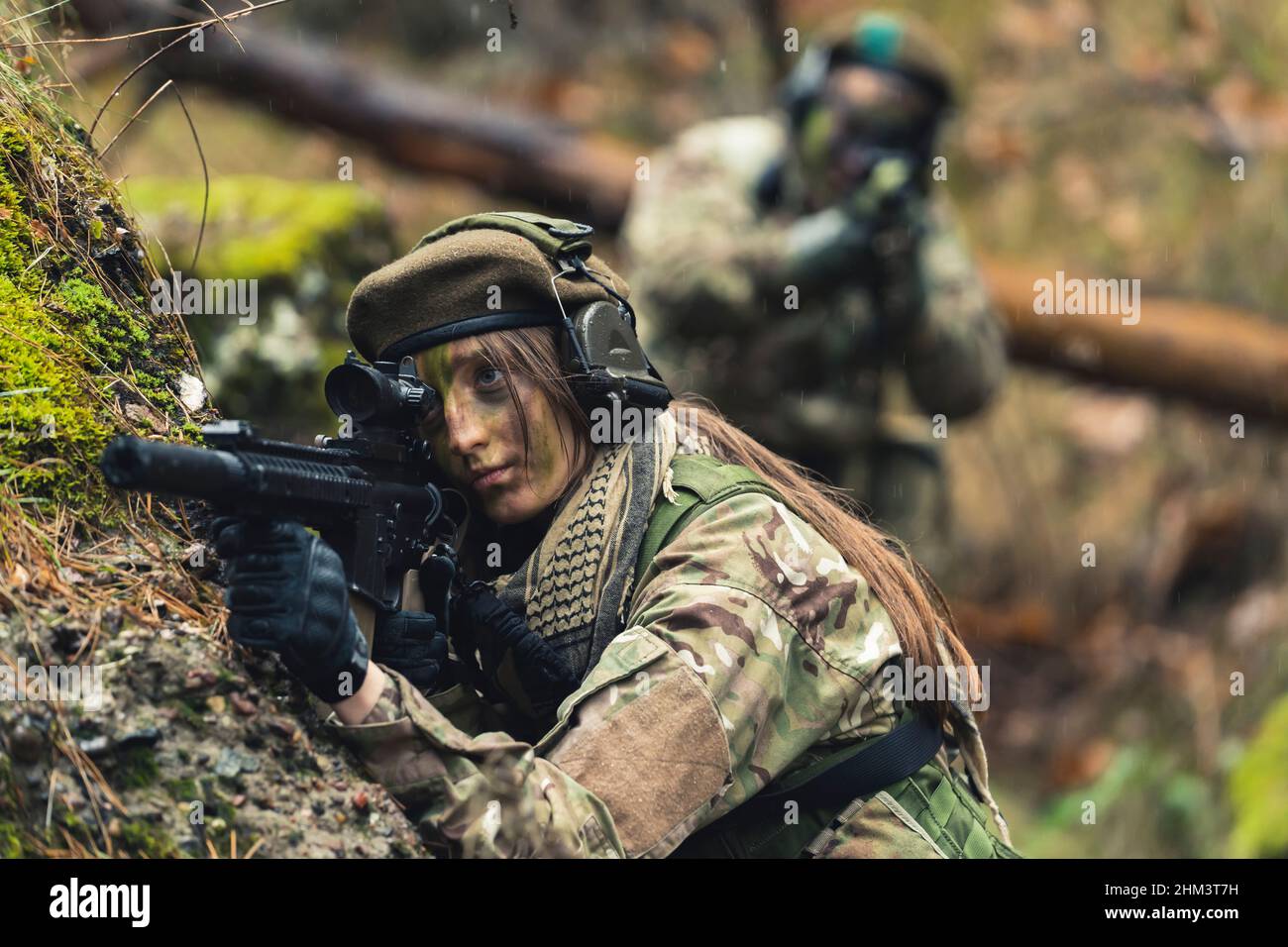 Resilient colonel tough women heroes aiming to protect Stock Photo